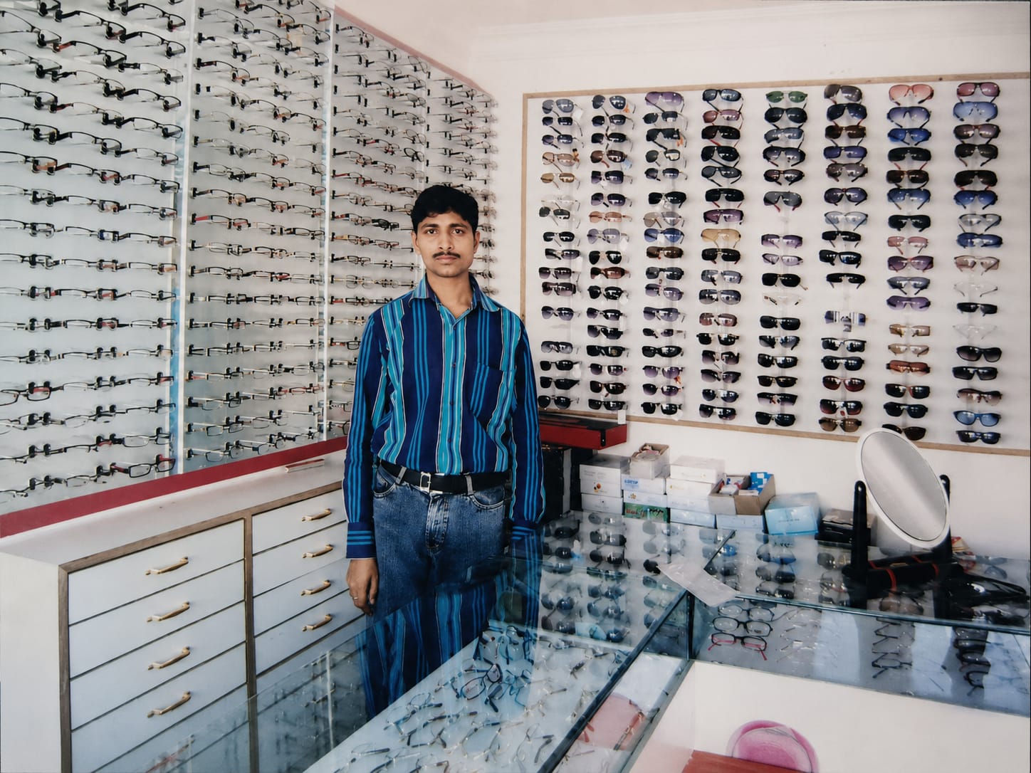 Arvind Dwivedi at the original Shivam Opticals shop, early days